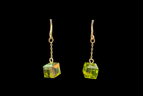 Horizontal front view of 1960s vintage square green iridescent crystal bead and gold tone chain link drop faux pierced clip-on earrings.