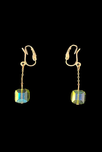 Vertical side view of 1960s vintage square green iridescent crystal bead and gold tone chain link drop faux pierced clip-on earrings.