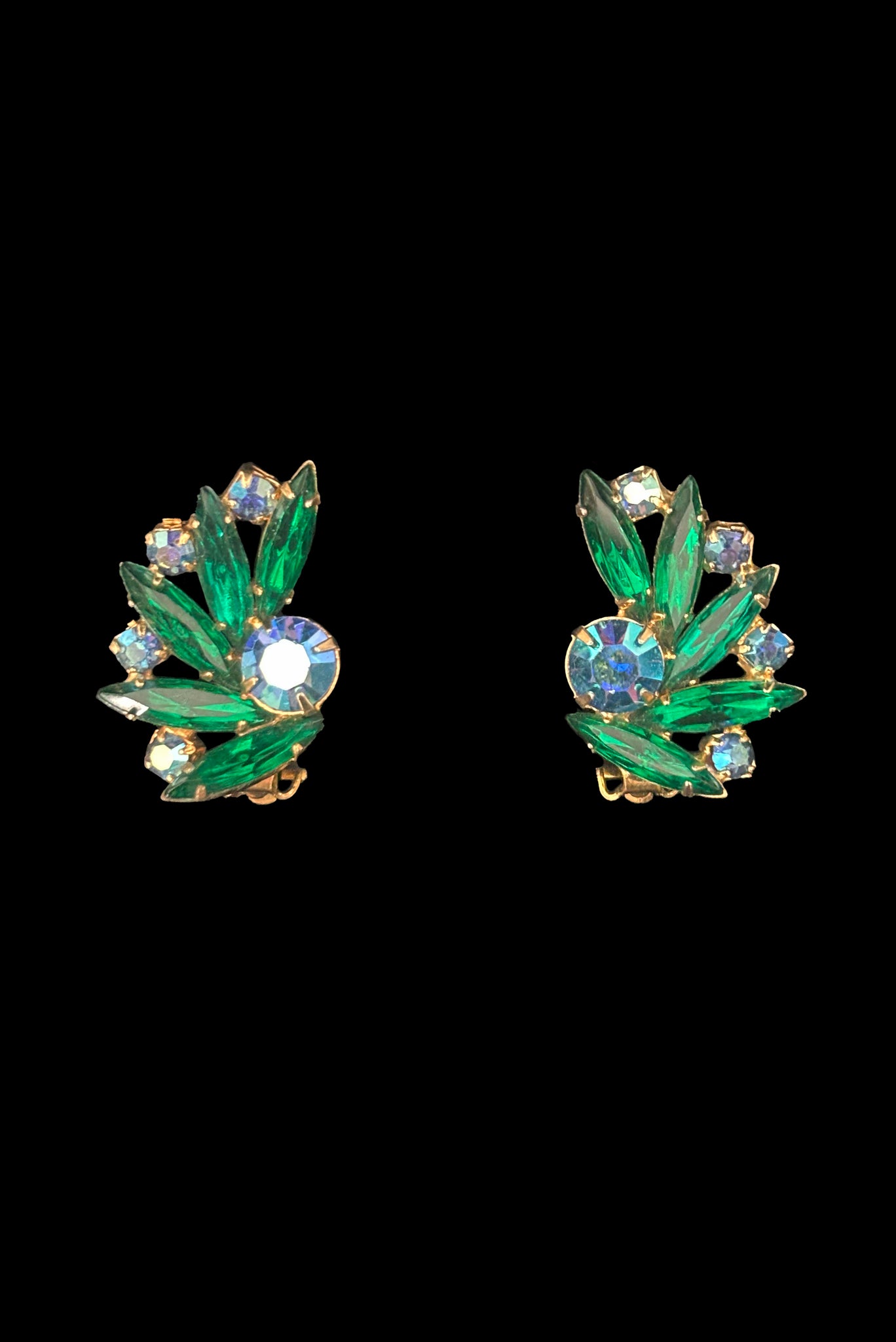 Vertical front view of 1950s vintage green marquise and blue iridescent round rhinestone fan shaped clip-on earrings.
