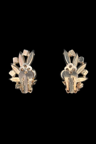 Vertical back view of 1950s vintage green marquise and blue iridescent round rhinestone fan shaped clip-on earrings.