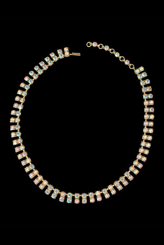 Vertical front view of 1950s vintage gold tone double row iridescent round holographic rhinestone adjustable choker necklace.