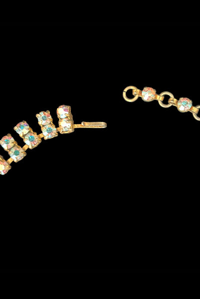 Detail view of 1950s vintage gold tone double row iridescent round holographic rhinestone adjustable choker necklace. Showing a close-up of the hook adjustable closure.
