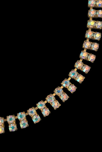 Detail view of 1950s vintage gold tone double row iridescent round holographic rhinestone adjustable choker necklace. Showing a close-up of the double row of iridescent round brilliant cut rhinestones.
