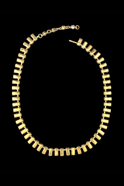 Vertical back view of 1950s vintage gold tone double row iridescent round holographic rhinestone adjustable choker necklace.