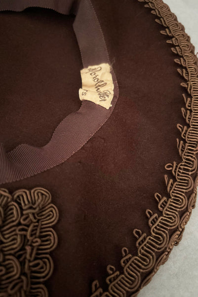 Detail view of 1940s vintage chocolate brown felt wide brim saucer hat trimmed in matching braid, by Dorothy Potter. Showing some moth nibbles on the underside of the brim.