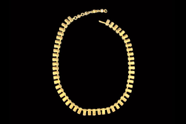 Horizontal back view of 1950s vintage gold tone double row iridescent round holographic rhinestone adjustable choker necklace.