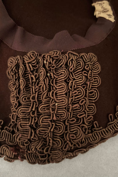 Detail view of 1940s vintage chocolate brown felt wide brim saucer hat trimmed in matching braid, by Dorothy Potter. Showing braid embellishment on the underside of the brim.