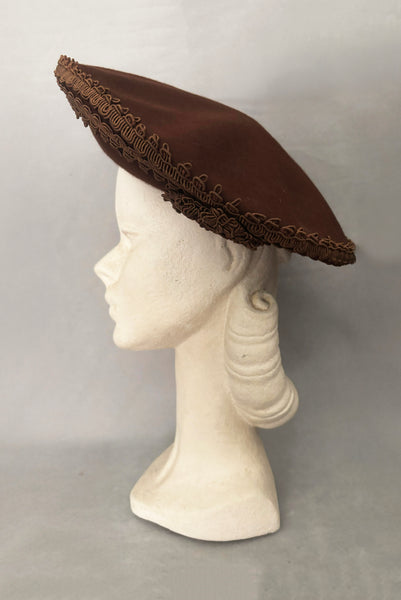Vertical side view of 1940s vintage chocolate brown felt wide brim saucer hat trimmed in matching braid, by Dorothy Potter.