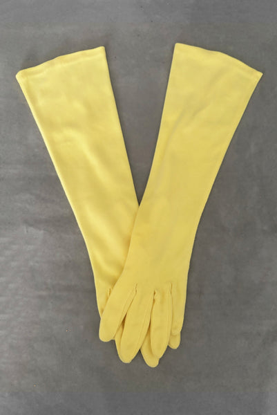Vertical pair view of 1950s vintage below elbow yellow nylon gloves by Hansen. Size 6.