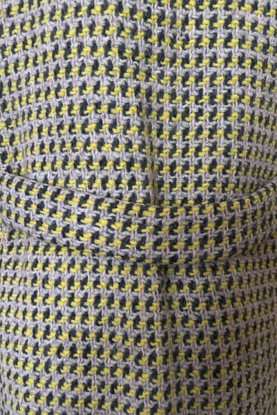 Detail view of 1960s vintage citron yellow, gray, and white bracelet sleeve, knee length wool coat, by Paul Blumenstein, size small to medium. Showing a close-up of the belted back.