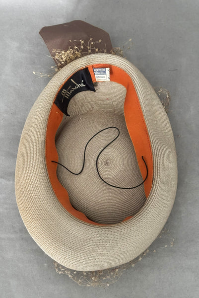 Vertical interior view of 1940s vintage taupe straw riding style tilt topper hat with matching petersham ribbon and veiling trim, by Marche.