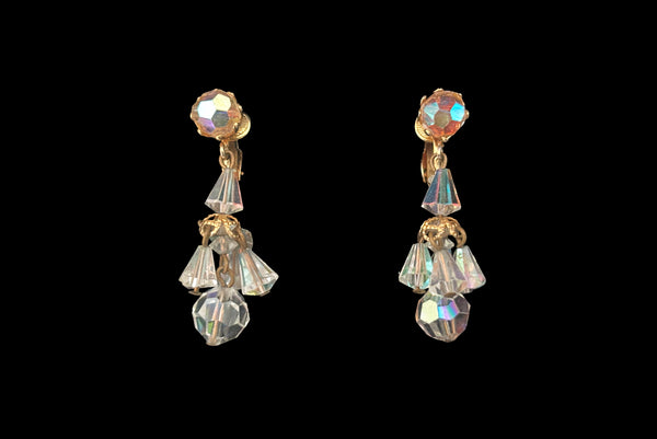 Horizontal front view of 1960s vintage iridescent crystal bead and gold tone chandelier drop earrings.