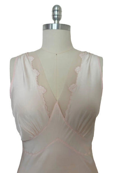 Bodice front view of 1930s vintage blush pink rayon and mesh lingerie applique bias cut nightgown by Seamprufe, size small to medium. Showing the leaf applique mesh deep V neckline.
