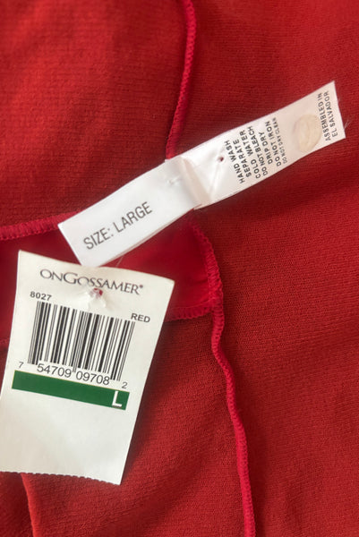 Interior detail view of new with tags 2000s y2k vintage deadstock ruby red mesh and satin, V-neck, sleeveless, empire waist top by On Gossamer, size medium to large. Showing the size Large, fabric care, and paper store tag.