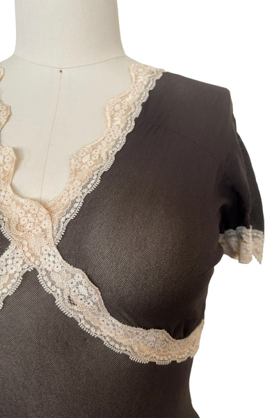 Detail view of new with tags 2000s y2k vintage deadstock sheer brown mesh and cream lace nylon, V-neck, short sleeve top by Petit Pois, size small to medium. Showing the cream floral lace trim at the v-neckline, under the bust, and at the short sleeves.