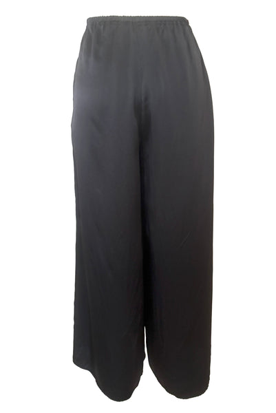Back view of 2000s y2k vintage black silk charmeuse satin elastic waist, high rise, wide leg pajama loungewear pants, by Hanky Panky, size medium to large. New without tags.