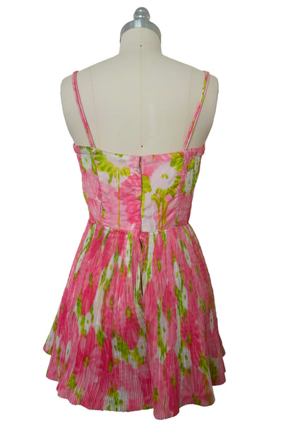 Back view of 1950s vintage pink, white, and chartreuse green watercolor floral print sweetheart neckline pleated skirt playsuit/mini dress by Gabar, size small to medium.