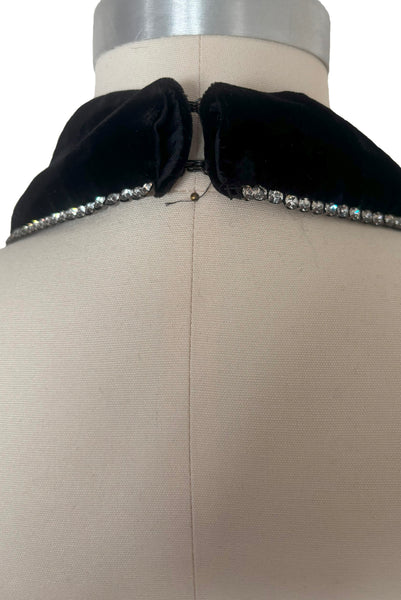 Detail view of 1990s vintage goth bat wing collar rhinestone trim evening dress by Betsy and Adam, size extra small to small. Showing one missing rhinestone on the end.