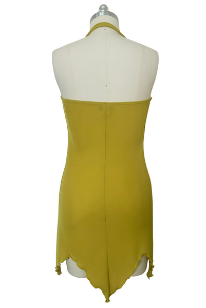 Back view of 2000s y2k vintage chartreuse green asymmetrical halter neckline, handkerchief hem polyester knit mini dress with iridescent glitter by Kitty, size small to medium.