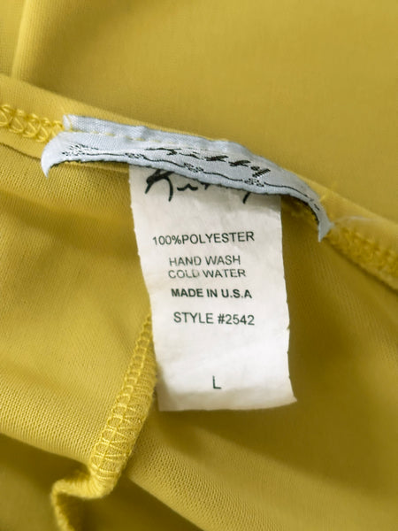 Interior detail view of 2000s y2k vintage chartreuse green asymmetrical halter neckline, handkerchief hem polyester knit mini dress with iridescent glitter by Kitty, size small to medium. Showing the 100% polyester, size L tag.
