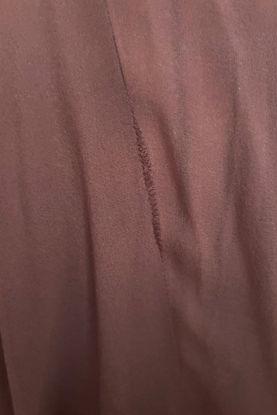 Detail view of 1960s vintage hot pink silk overblouse and brown silk chiffon two piece cocktail dress set, size extra small to small. Showing some stress to a seam in the silk chiffon skirt.