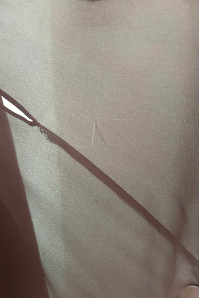 Detail view of 1960s vintage hot pink silk overblouse and brown silk chiffon two piece cocktail dress set, size extra small to small. Showing a small snag in the silk chiffon skirt.