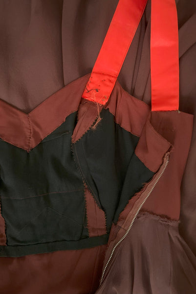 Interior detail view of 1960s vintage hot pink silk overblouse and brown silk chiffon two piece cocktail dress set, size extra small to small. Showing the interior construction details of the dress with brown rayon sweetheart bodice and contrasting orange silk satin straps.
