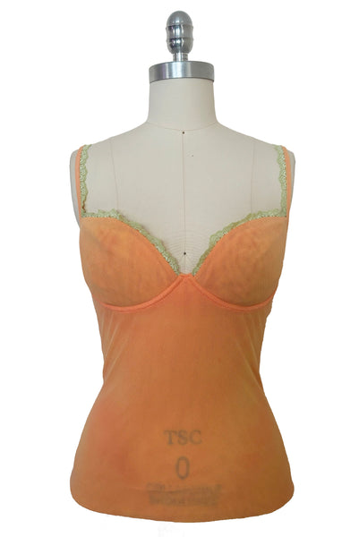 Front view of 2000s y2k vintage, as is, new with tags creamsicle orange mesh and green lace underwire bustier with laced back by Cosabella, size extra small to small.