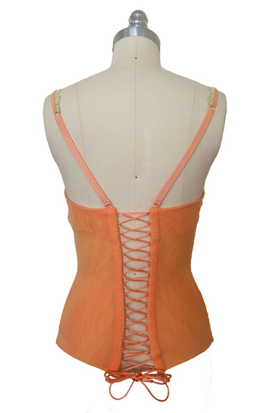 Back view of 2000s y2k vintage, as is, new with tags creamsicle orange mesh and green lace underwire bustier with laced back by Cosabella, size extra small to small.