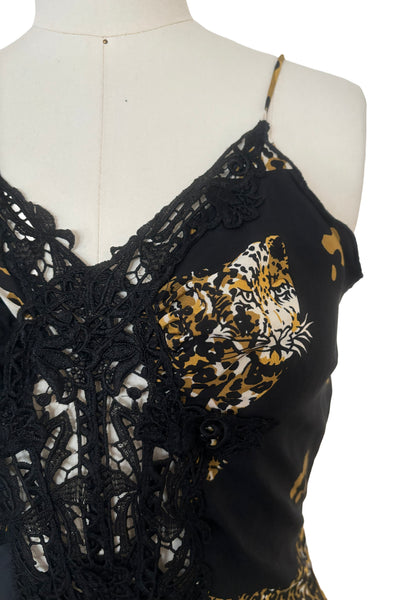 Detail view of 1990s vintage leopard animal print black silk and re embroidered lace camisole top by Sky, size extra small to small. Showing the lace at the sweetheart neckline and down the center front.