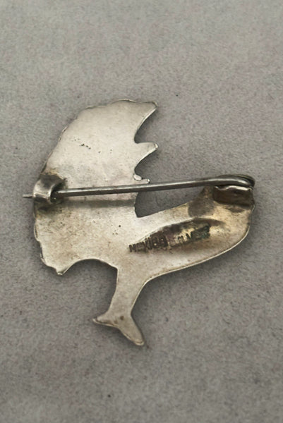 Detail view of 1930s vintage Mexican sterling silver pair of bird brooches. Showing the back of a single brooch with the Mexico and Sterling stamps.