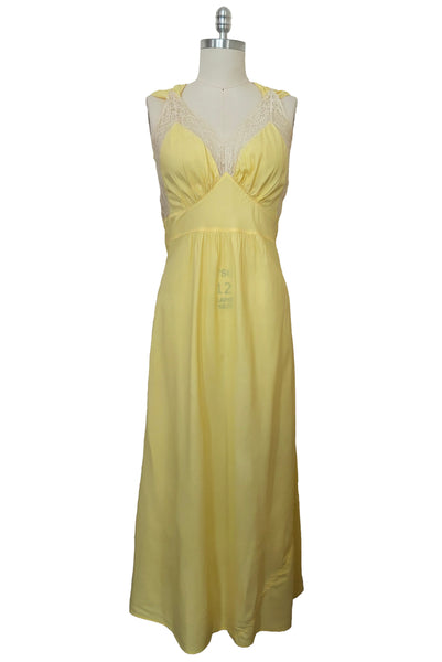 Front view of vintage 1940s yellow bias cut rayon and cream lace sweetheart neckline nightgown, medium to large.