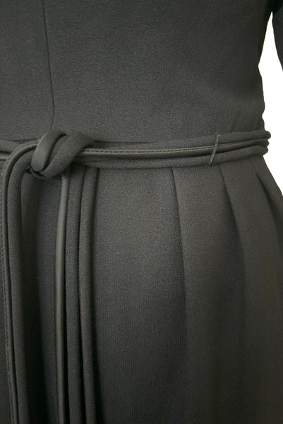 Waist front detail view of 1950s vintage long sleeve, V-neck black crepe wiggle dress with triple stand self tie belt, by R&K Originals, small to medium. Showing the pleats at the waistline and triple strand tie belt.