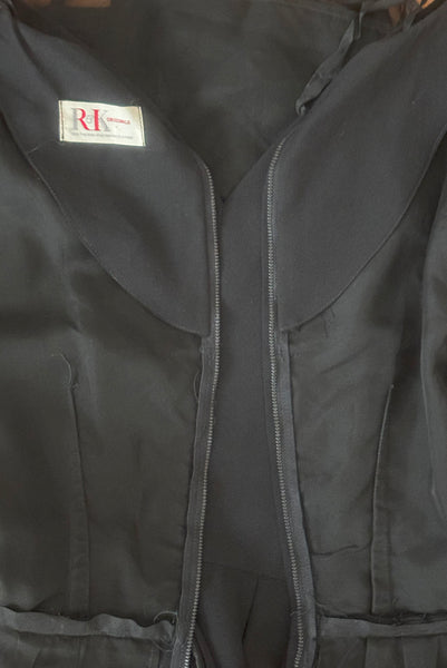 Interior detail view of 1950s vintage long sleeve, V-neck black crepe wiggle dress with triple stand self tie belt, by R&K Originals, small to medium. Showing the facings and organza underlining.