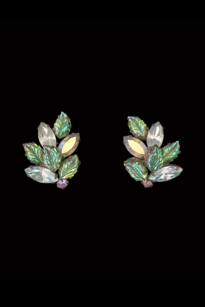 Vertical front view of 1950s vintage iridescent teal blue green pressed glass and marquise rhinestone leaf clip-on earrings.
