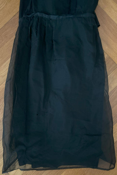 Interior skirt view of 1950s vintage long sleeve, V-neck black crepe wiggle dress with triple stand self tie belt, by R&K Originals, small to medium. Showing the organza underlining.