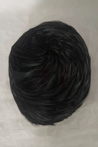 Vertical top view of 1960s vintage jet black feather and felt casque hat.