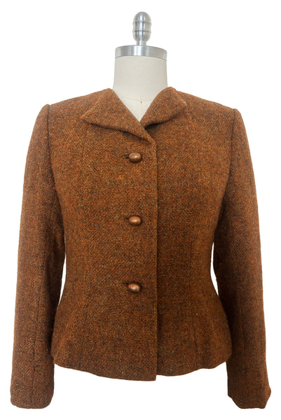 Front view of 1960s vintage rust brown wool, three copper metal button, long sleeve jacket by Pauline Trigère for Bergdorf Goodman, size medium to large.