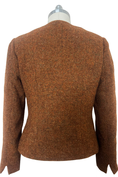 Back view of 1960s vintage rust brown wool, three copper metal button, long sleeve jacket by Pauline Trigère for Bergdorf Goodman, size medium to large.
