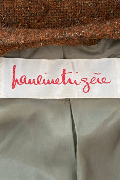 Interior detail view of 1960s vintage rust brown wool, three copper metal button, long sleeve jacket by Pauline Trigère for Bergdorf Goodman, size medium to large. Showing the Pauline Trigère label.