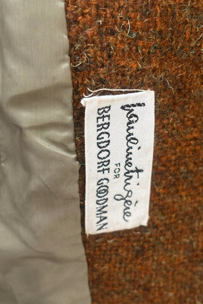Interior detail view of 1960s vintage rust brown wool, three copper metal button, long sleeve jacket by Pauline Trigère for Bergdorf Goodman, size medium to large. Showing the Pauline Trigère for Bergdorf Goodman label.
