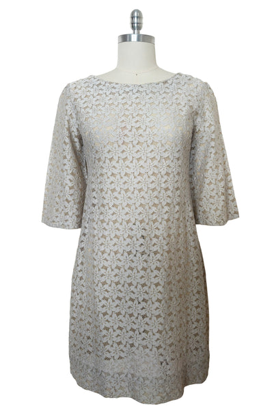 Front view of 1960s vintage white and beige floral lace shift dress, size medium to large.