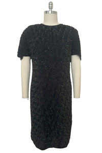 Front view of 1990s black sequin leaf pattern beaded cocktail dress, large to extra large.