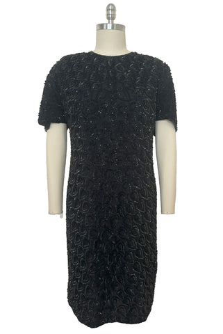 Front view of 1990s black sequin leaf pattern beaded cocktail dress, large to extra large.
