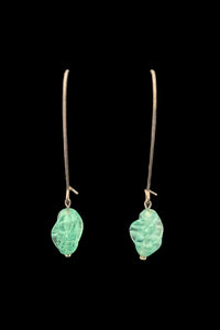 Vertical front view of 2010s vintage aqua blue glass lampwork bead drop on long silver tone earwires pierced earrings.