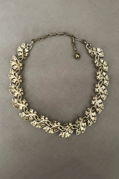 Vertical back view of 1950s vintage champagne gold tone leaf adjustable necklace by Lisner.