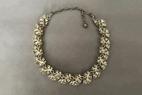Horizontal back view of 1950s vintage champagne gold tone leaf adjustable necklace by Lisner.