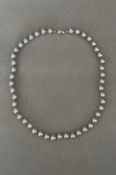 Vertical view of 1980s vintage designer gray faux pearl bead necklace, by Monet.