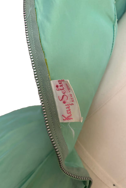 Interior detail view of 1950s vintage mint green iridescent taffeta shelf bust wiggle cocktail dress with balloon train by Kay Selig, extra extra small to extra small. Showing the Kay Selig label.