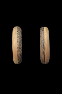 Vertical front view of 1980s vintage blonde and dark brown two tone wood hoop clip-on adjustable earrings.